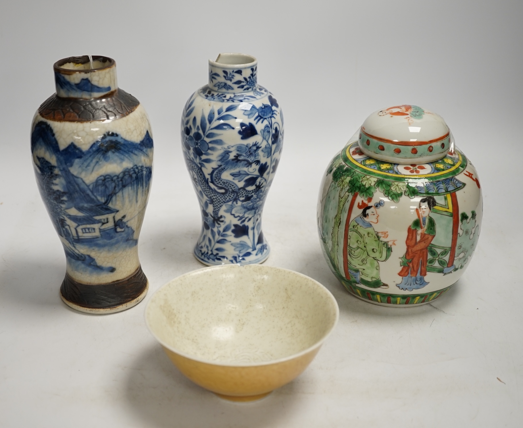 Chinese ceramics to include a crackleware vase and a blue and white vase, a jar and cover and a rice bowl, tallest 20cm high. Condition - all items damaged, overall poor